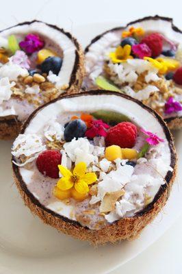 Fresh fruit bowls served out of a coconut, or fresh drinks served out of a pineapple.