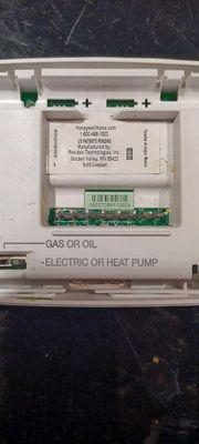 This shows in label along bottom, her thermostat was heat pump ready, and was set for such. Notice black switch beside label.