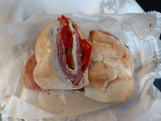 A Misroute sandwich. Chorizo, salami, sopressata, cappicola, Asiago cheese, oil and vinegar on a Portuguese roll.