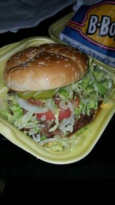 Close up of burger. Good patty, fresh veggies, & good sauce.