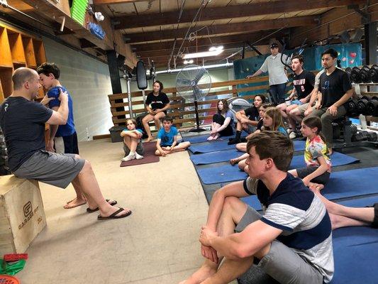 Karl Kolbeck, PT providing workshop to youth climbing team at The Circuit bouldering gym on shoulder health.