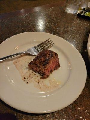 Filet on bread plate, one bite taken...