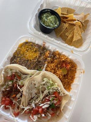 Two grilled fish taco plate, with rice, beans, 4 oz. guacamole, tortilla chips.... Delicious!