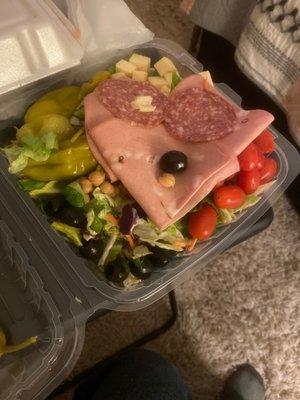 This is what you call an antipasto salad, a slab of cold cuts on top????! Hahahahahhahahahaha gimme a break !!!!