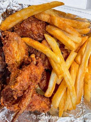 Fried chicken wings and fries