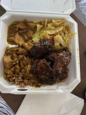 Curry and Jerk chicken, rice and beans and cabbage!