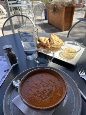 Tomato bisque with bread, no olive oil, a mountain of garlic in water, and a balsamic reduction.