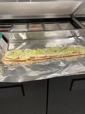 Foot long Italian sandwiches ham and salami and cheese for only $ 17.95