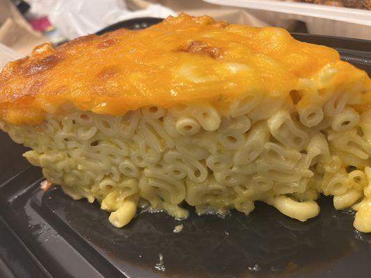 Their dry baked mac. ZERO flavor. No cheese baked into it, only a layer on top of their unseasoned mac.