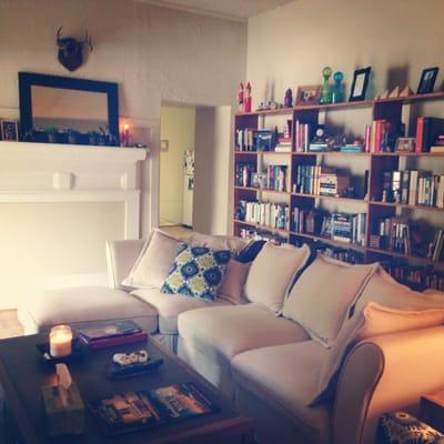 Cream linen sectional and awesome coffee table!