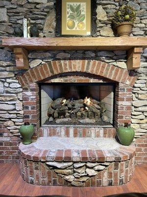 If you're looking for a more traditional look you might favor a open faced fireplace. This Georgian 50 can burn wood or gas logs.