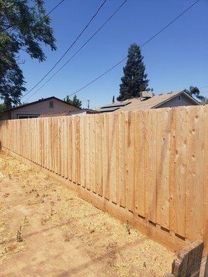 6ft high cedar fence with pickets to cover the gaps