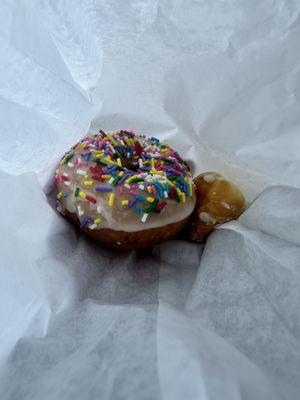 Yummy sprinkle donut and a couple donut holes