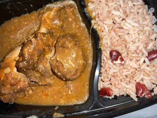 Brown stew chicken and rice and peas