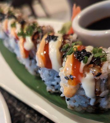 Imperial Roll - Salmon, Tuna, cream cheese, avocado, spicy mayo, Salmon Caviar, garlic aioli.