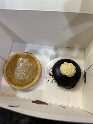 Pumpkin torte and chocolate mousse bomb with passion fruit filling