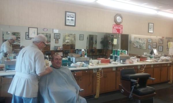 This customer didn't mind having his photo taken and is happy to get a haircut