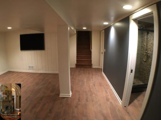 New bathroom has been added with pocket door and wood plank porcelain tile, Venere oak staircase and Navy blue accent wall