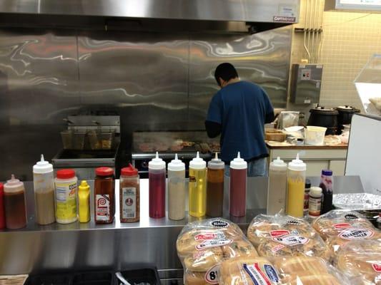 Cooking up some steak and cheese sandwiches.