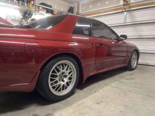 Tires mounted to rims and installed onto car.