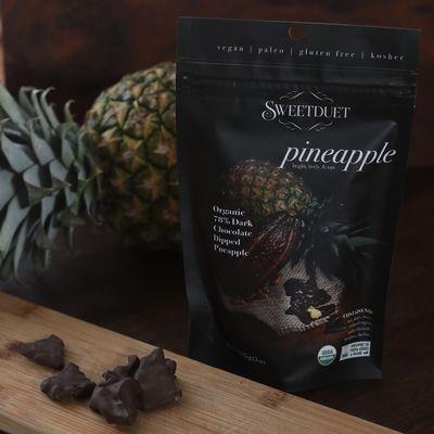 Organic pineapple dipped in 78% date nectar sweetened chocolate.