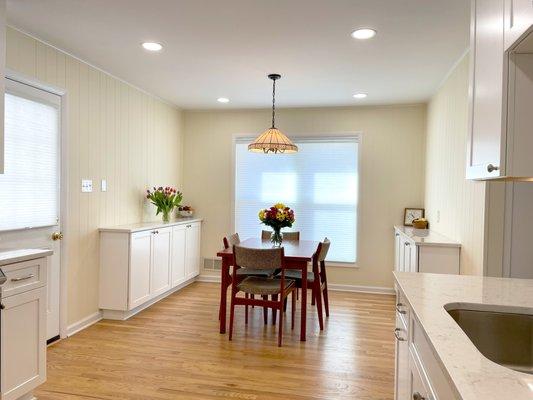 White modern Kitchen with hardwood floor and quartz countertop. design and installed by Aladdin Carpet and Floors