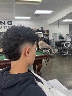 Mid Burst Fade W/ Curls on Top