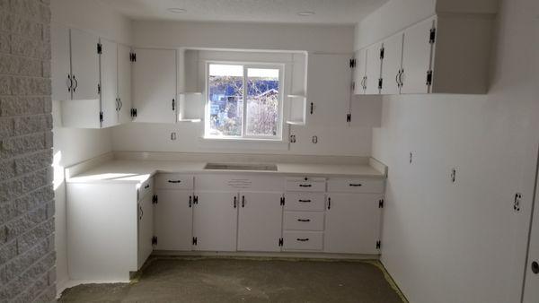 Kitchen cabinet repaint, with original hinges painted black