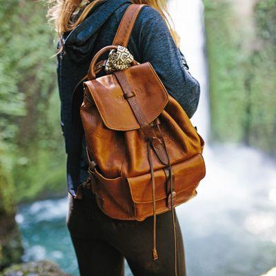 At the waterfall with her Rainier backpack