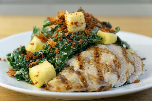 Kale Caesar Salad:
Grilled chicken served over kale tossed in a lemon Caesar dressing topped with polenta croutons and toasted Parmesan.