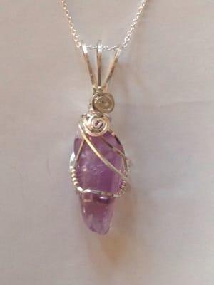 Custom wrapped amethyst and silver pendant