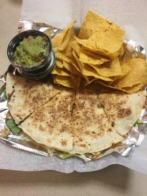 Chicken quesadilla with a side of queso & guat with home made tortilla chips