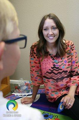 Our SLP Brittany, working with a young boy at Big Horn Basin Hearing and Speech.