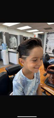 John gives my son a great haircut every time. He does a great job. My son and I are very pleased. I recommend John the best barber