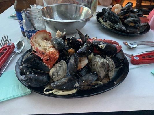 Seafood over linguine with garlic wine sauce