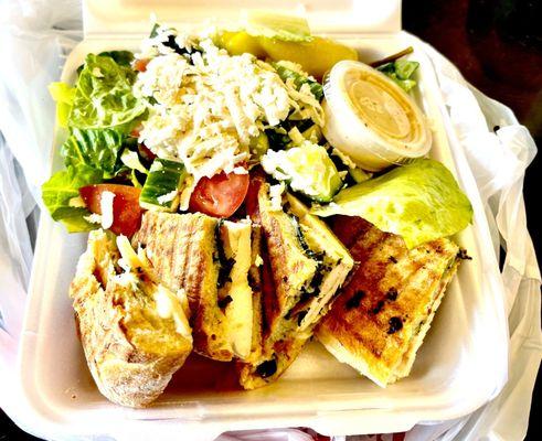 The chicken pesto Panini with a side Greek Salad! Mouth watering!