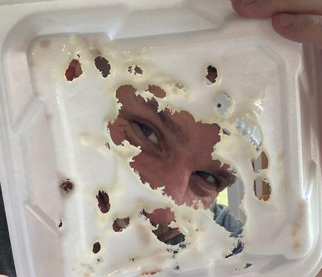 This is the styrofoam container the fried food was in. No paper liner was placed between the food and the container by the "cook".