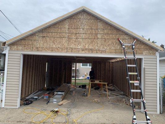 Two car garage with a party door