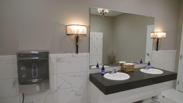 Locker room bottle-fill station and sinks.