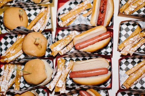 Hamburger sliders, mini hot dogs and funnel cake fries dusted with powdered sugar.