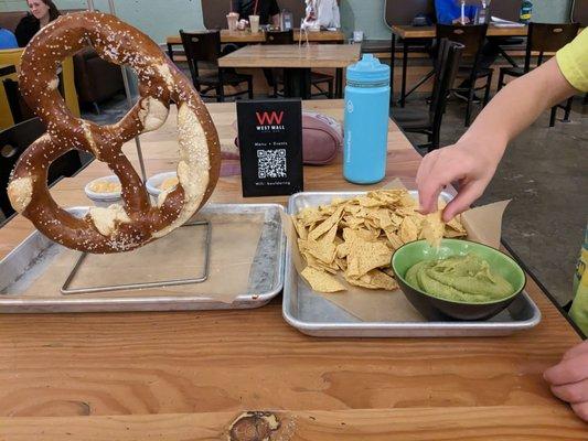 Pretzel and chips with guacamole