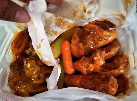 Good basic whole wings. Well cooked. Hot sauce on right was thin... Honey gold on left was nice and thick.  Both were tasty.