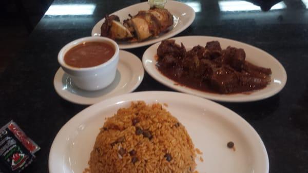 Goat stew, chicken, yellow rice n beans