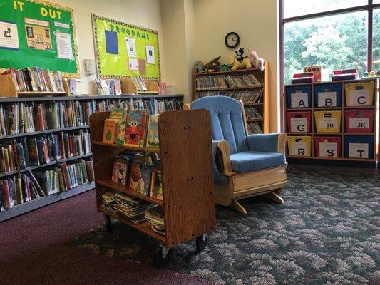 A place for nursing/bottle feeding mothers to sit. Good story time spot too.