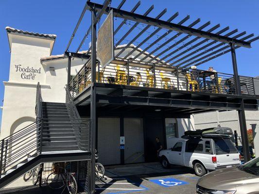 Outdoor seating and stairs up to the cafe