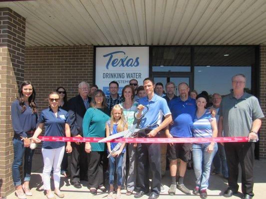 Ribbon cutting at their new location