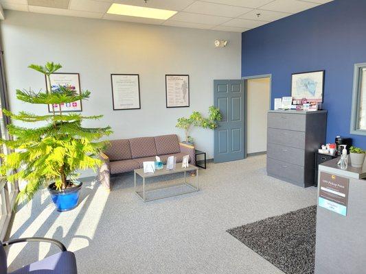 Reception area staffed by patient care coordinator.