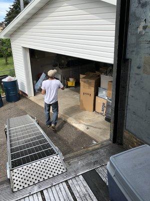 Unloading a semi trailer for a customer in Kingsford