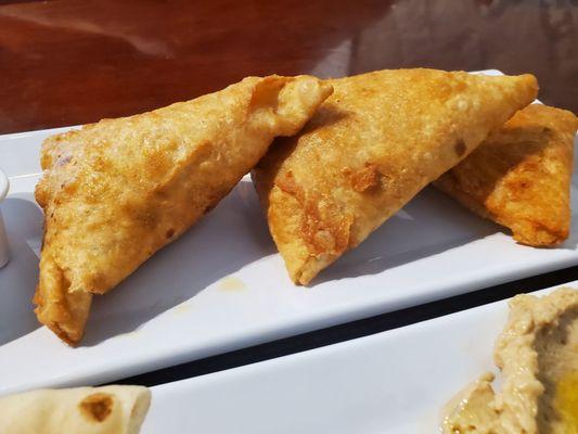 Samosas. Would recommend serving either a plate of 2 or 4. Three makes sharing weird.