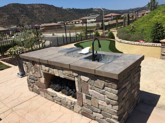 Outdoor Kitchen BBQ with Fireplace and Sink